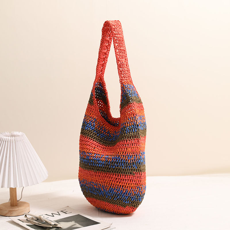 Large capacity woven shoulder straw bag by Wanita Store, perfect for seaside vacations and casual beach outings.