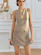Women’s sleeveless elegant dress with rose front buttons, round neck, and waist trimming by Plush Fashion Hub.