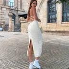 Women’s mid-length lace-up backless dress with V-neck, hollow-out cutout, halter design, perfect for autumn occasions.
