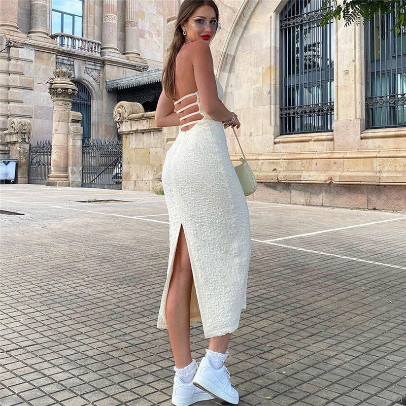Women’s mid-length lace-up backless dress with V-neck, hollow-out cutout, halter design, perfect for autumn occasions.