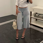 Casual sports cropped pants by Wanita Store featuring high waist, solid color, straight-leg design, and wide-leg fit.