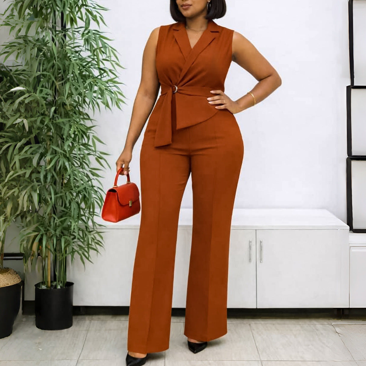 Light blue sleeveless jumpsuit with collar, lace-up front, wide-leg pants, perfect for summer, by Plush Fashion Hub.
