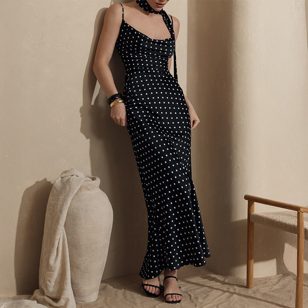 Polka dot strap maxi dress by Plush Fashion Hub featuring halter straps and a fishtail design, perfect for summer occasions.