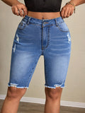 Casual women’s denim tight shorts from Wanita Store featuring a fitted design and classic blue wash.