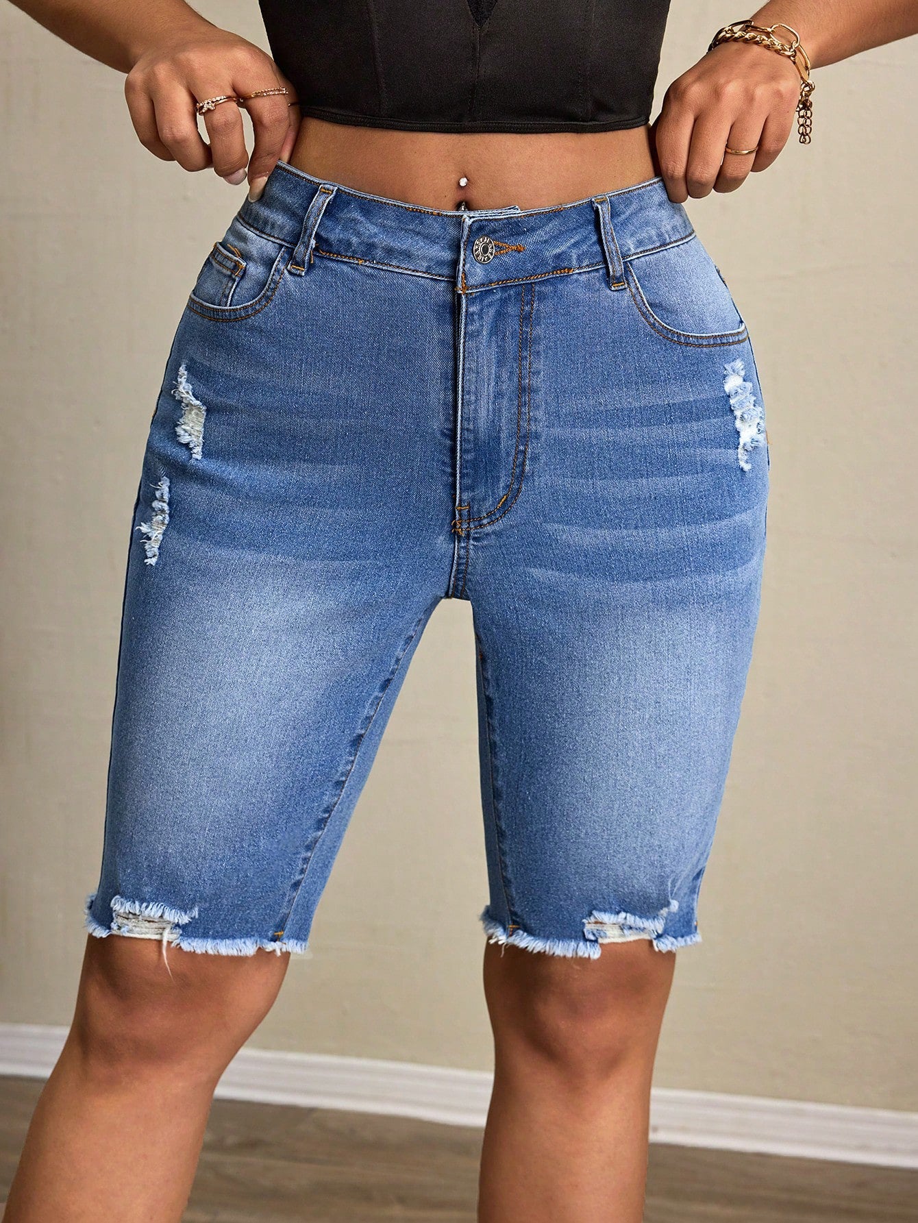 Casual women’s denim tight shorts from Wanita Store featuring a fitted design and classic blue wash.