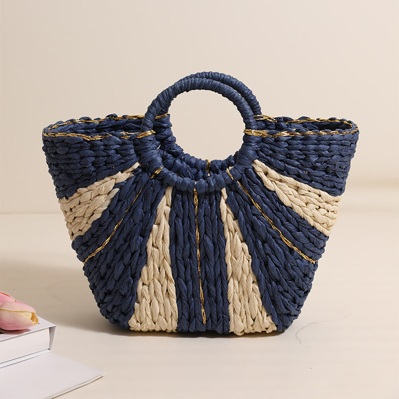 Bella Mia large straw woven bag with contrast handles, ideal for beach, vacation, or vegetable shopping, hand-carried and spacious.