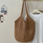 Large capacity cotton woven straw bag with cutout design, ideal for beach or vacation, casual shoulder bag for women.