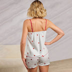 Bella Mia spring homewear set featuring heart-print satin suspender shorts and matching two-piece pajama top for women.