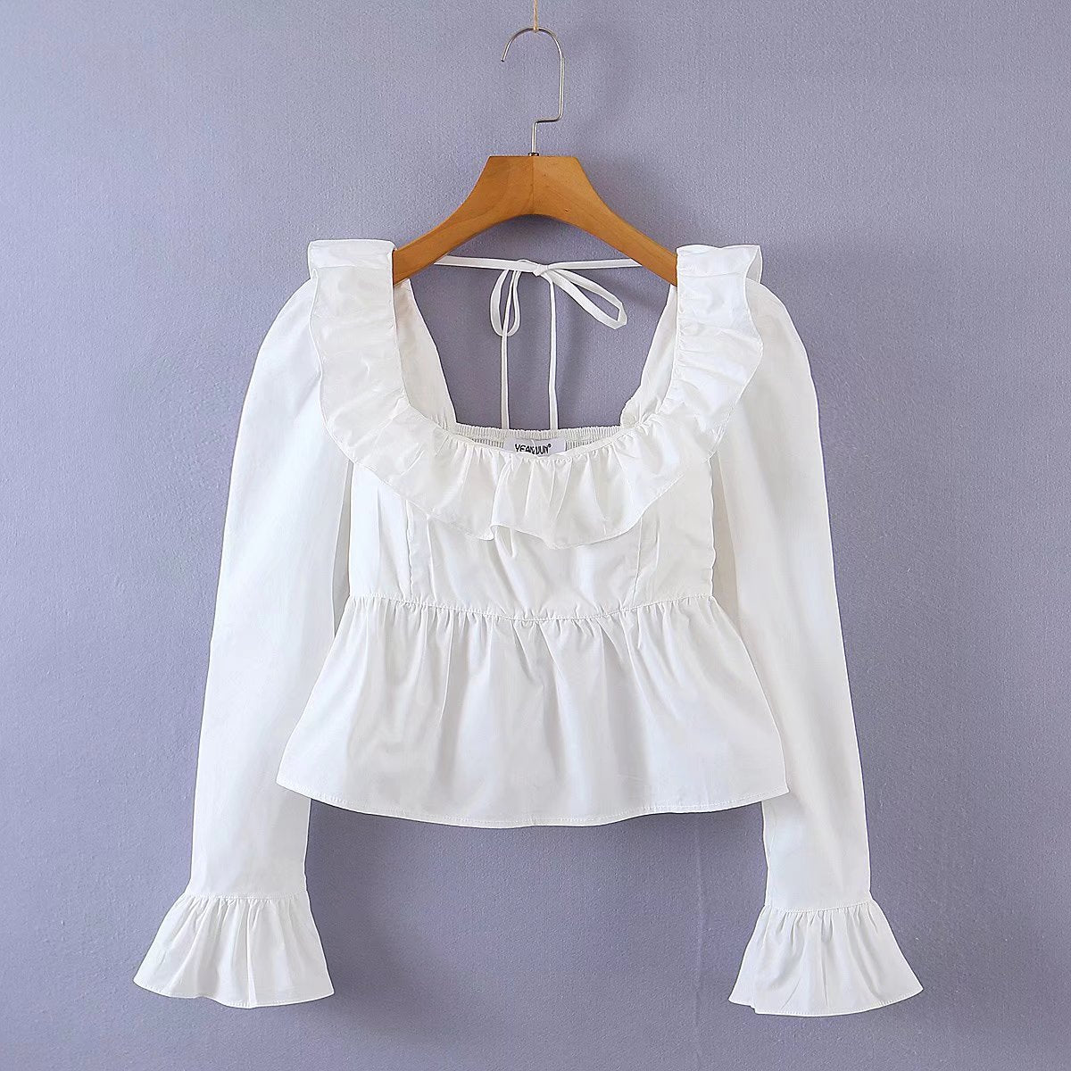 Bella Mia Summer Wind solid color long sleeve ruffled shirt for women, featuring a stylish and elegant design with ruffle details.