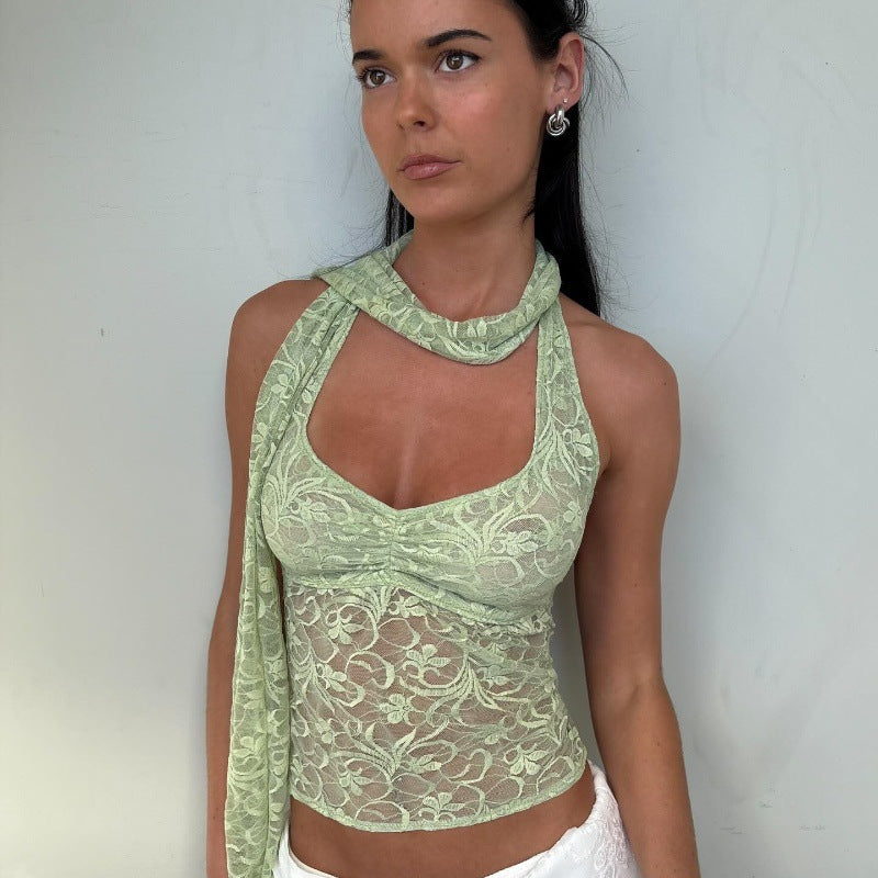 Women’s summer lace halterneck vest top by Bella Mia, see-through design with decorative ribbons and a stylish short fit.