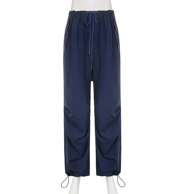 Blue loose woven wide-leg sports pants for women, casual summer streetwear, shown on a model.