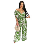 Women’s off-shoulder batwing sleeve wide-leg printed jumpsuit by Bella Mia, featuring a stylish, flowy design and vibrant print.