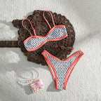 Printed strap bikini two-piece set by Bella Mia featuring colorful seaside-themed design, perfect for spring beachwear.