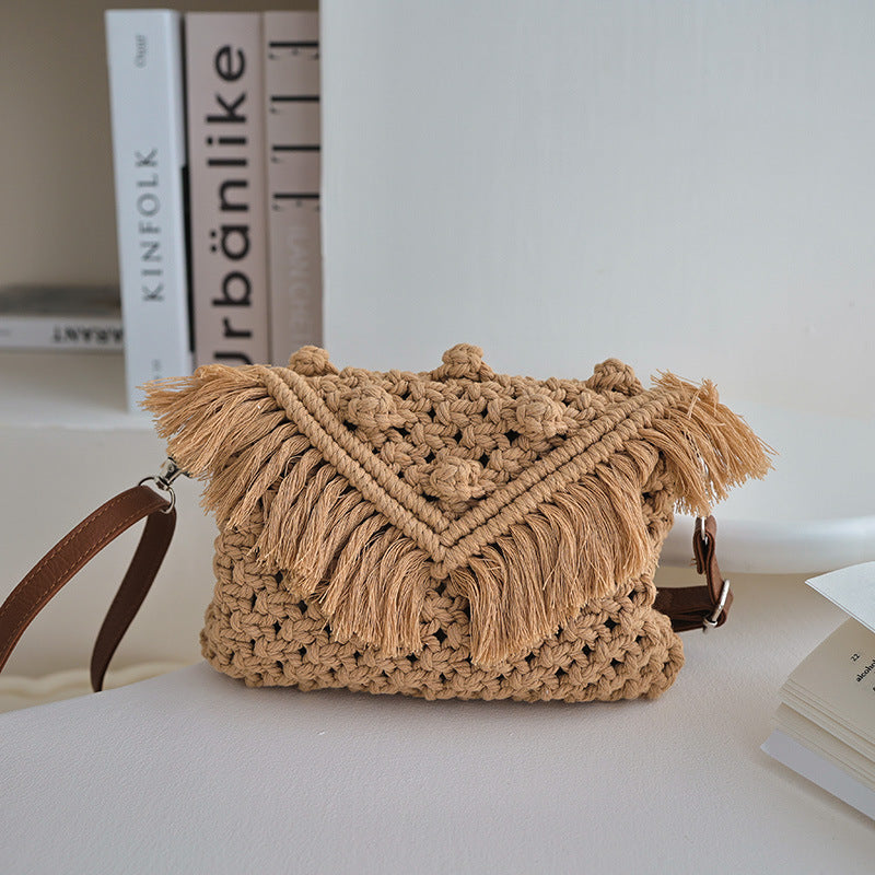 Bella Mia woven cotton beanie crossbody bag with tassels, straw shoulder strap, perfect for beach or vacation use