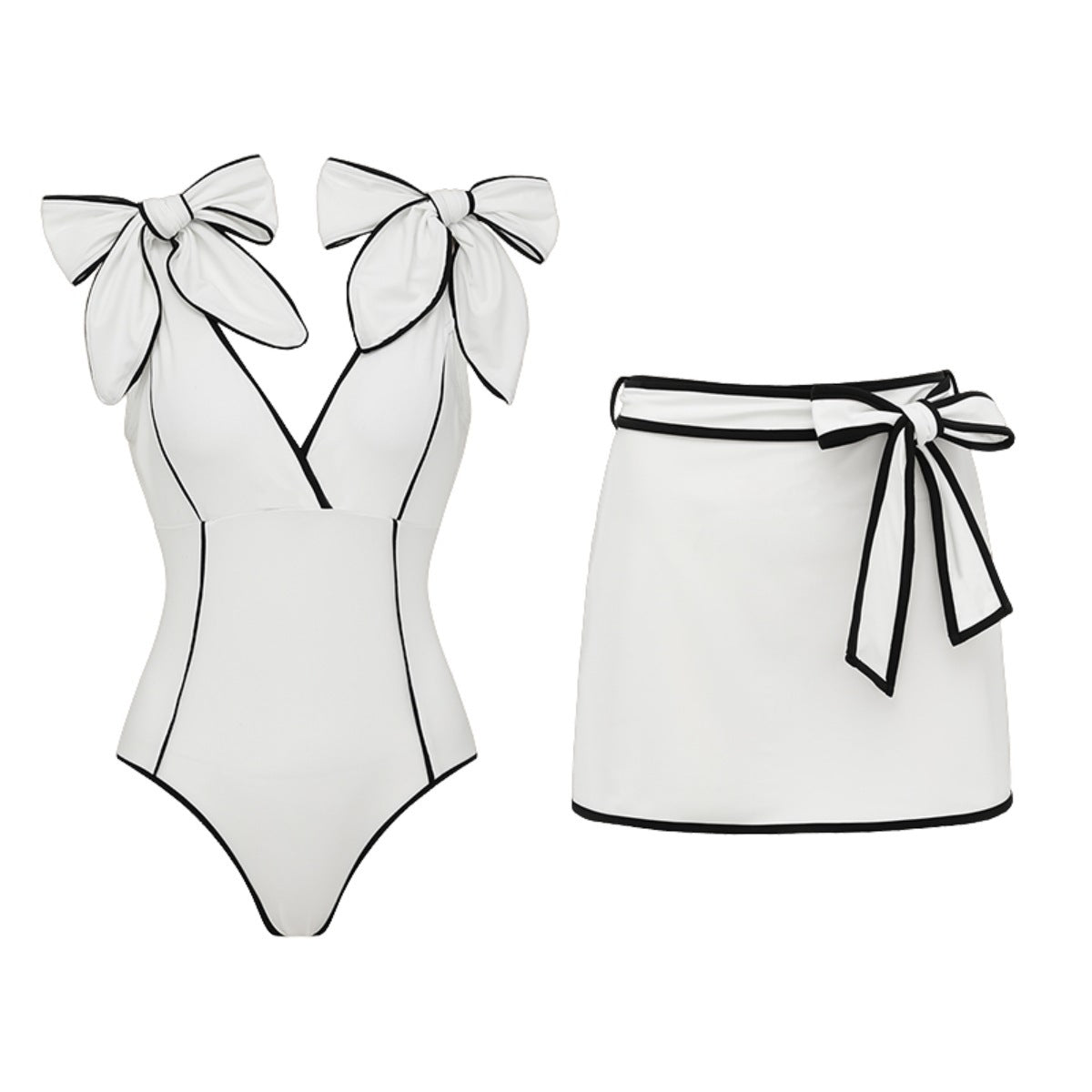 Black and white matching girl’s swimsuit with bow and white skirt, stylish swimwear for women by Plush Fashion Hub.