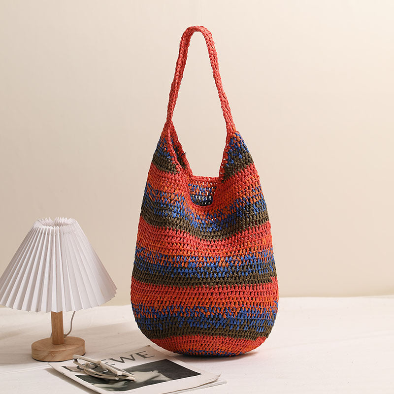 Large capacity woven straw shoulder bag by Plush Fashion Hub, casual seaside beach bag with colorful design and matching woven style.