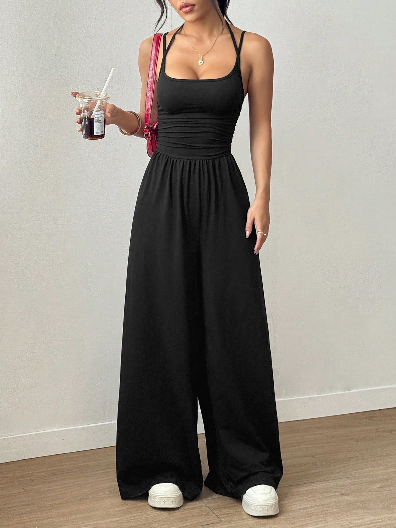 Women’s casual summer jumpsuit with wide-leg pants, wrapped chest, nipped waist, and suspenders by Plush Fashion Hub.