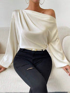 Bella Mia women's long sleeve satin pullover top with oblique shoulder design and asymmetric silhouette in solid color.