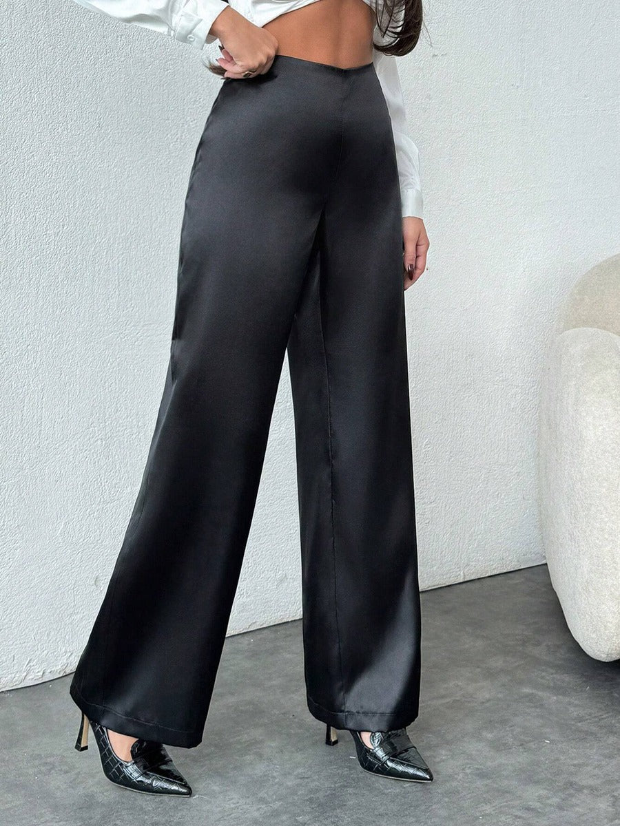 Women’s black satin wide leg casual pants by Bella Mia, loose autumn satin pants with a relaxed fit and stylish design.