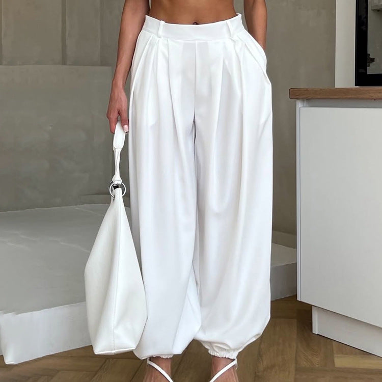 Women’s white tapered casual trousers by Plush Fashion Hub with high waist, loose fit, pleated design, perfect for everyday wear.