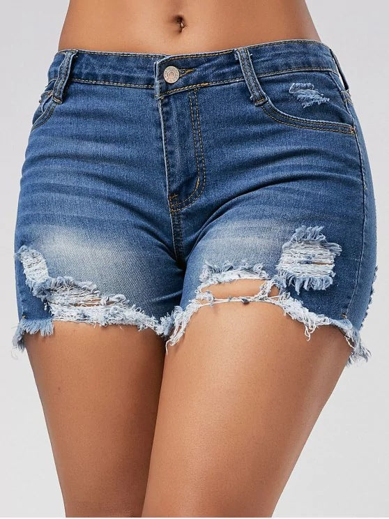 Supply ripped horsetail tassel denim shorts for women, featuring distressed denim and tassel details by Plush Fashion Hub.