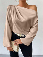 Bella Mia women's long sleeve satin pullover with oblique shoulder design, asymmetric cut, and solid color for a stylish look.