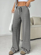 Casual women's striped solid color straight-leg pants with rubber band and drawstring, suitable for autumn and winter wear.
