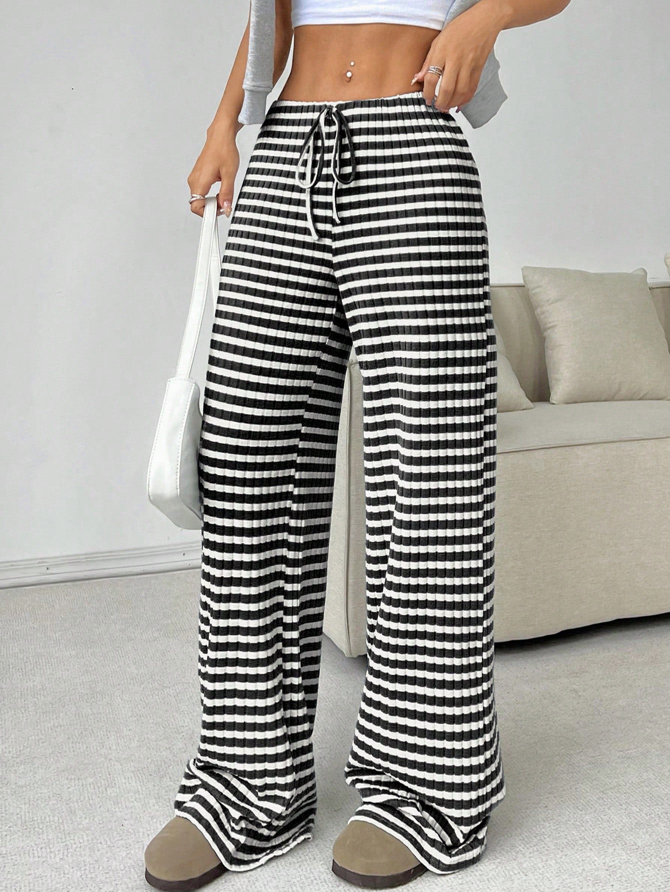 Casual women's striped solid color straight-leg pants with rubber band and drawstring, suitable for autumn and winter wear.