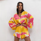 Women’s summer V-neck printed jumpsuit by Bella Mia featuring long sleeves, waist trimming, and ruffle shorts.