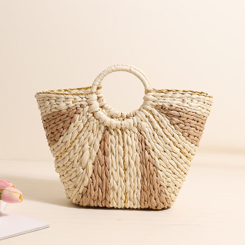 Bella Mia large straw-weaved tote bag with contrast handles, perfect for beach, vacation, or vegetable basket use.