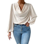 Loose draped V-neck long-sleeved shirt for women by Bella Mia, featuring a relaxed fit and casual style.