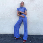 High waist blue pleated wide-leg pants with a slim fitting T-shirt, casual women's fashion outfit from Wanita Store.