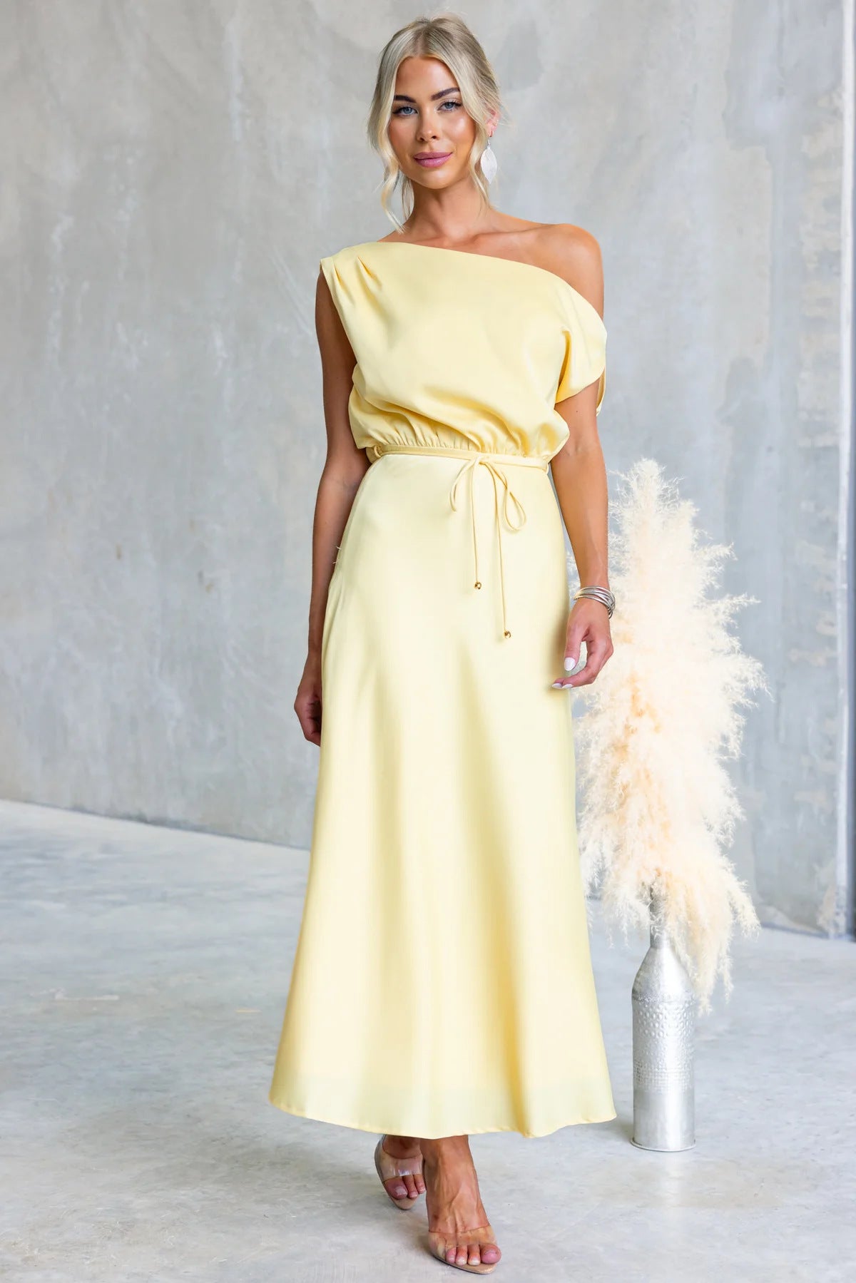 Summer off-shoulder tied dress by Plush Fashion Hub featuring a sloping shoulder design in a solid color for a stylish summer look.