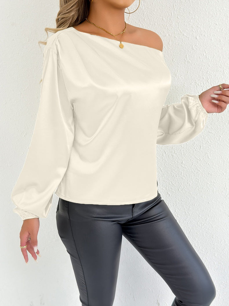White women's long sleeve satin shirt by Bella Mia, perfect for summer, with a smooth, shiny fabric and elegant fit.