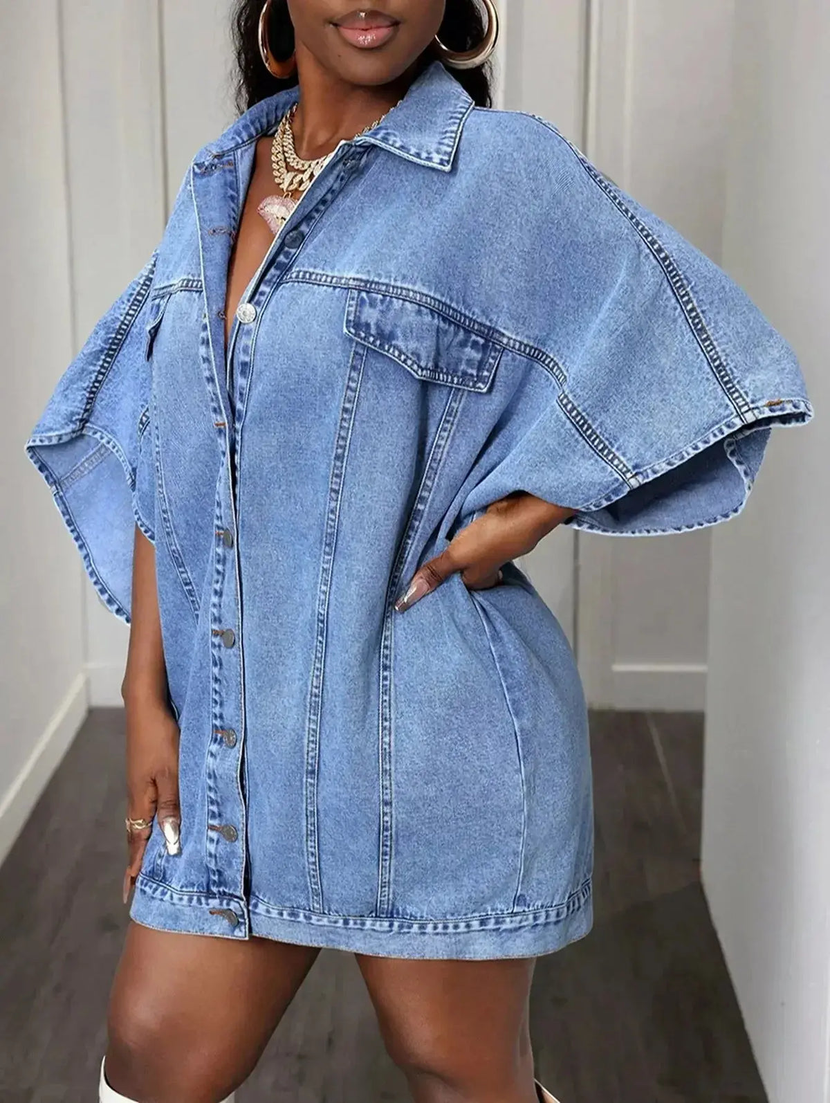 Women's oversized denim button-down shirt with batwing sleeves from Plush Fashion Hub, casual and trendy for everyday wear.