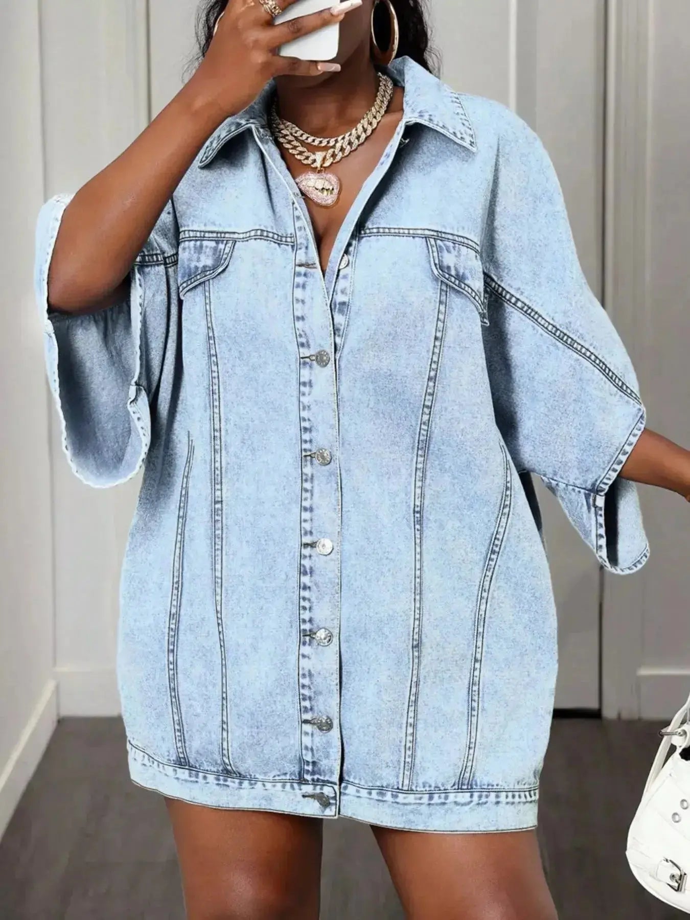 Oversized women's denim button-down shirt with batwing sleeves, casual fashion from Trendsi.