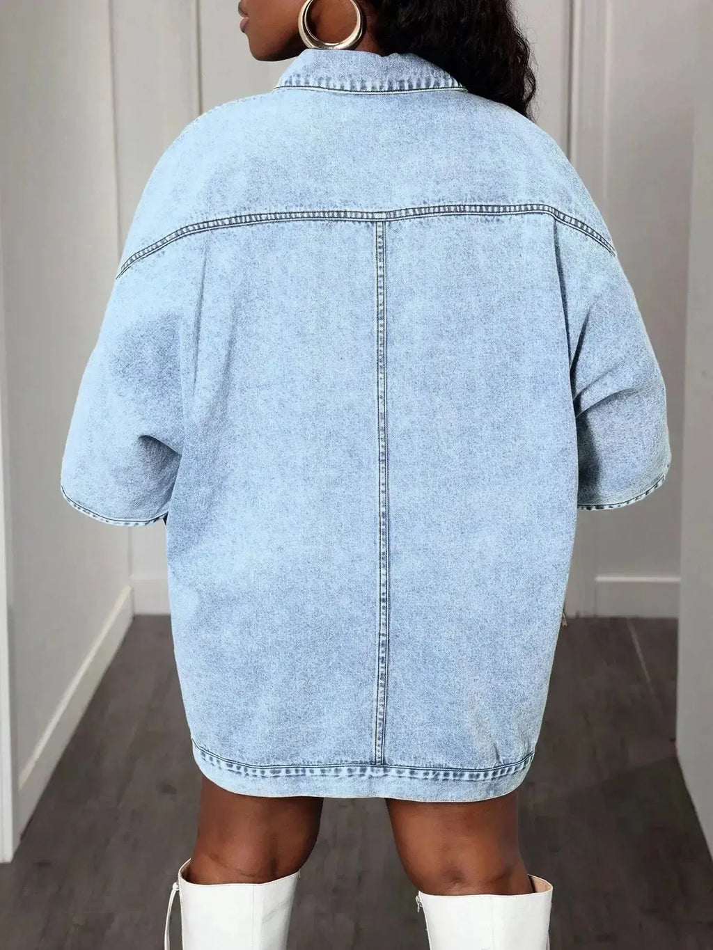 Oversized denim button-down shirt for women with batwing sleeves from Trendsi, featuring a relaxed fit and classic denim styling.