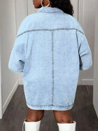 Oversized denim button-down shirt for women with batwing sleeves from Trendsi, featuring a relaxed fit and classic denim styling.