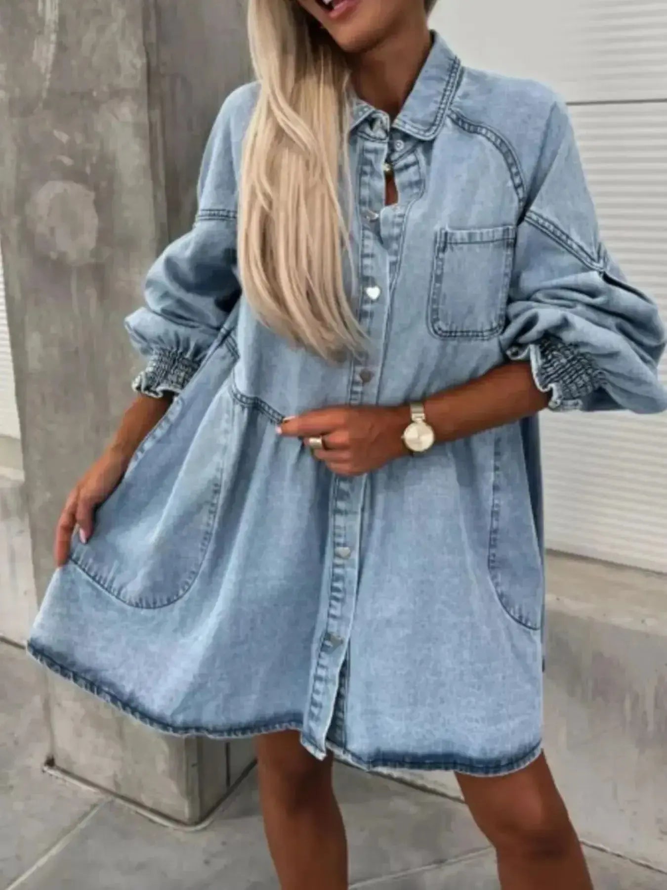 Oversized long sleeve denim button-up dress by Trendsi featuring a relaxed fit and classic blue denim fabric.