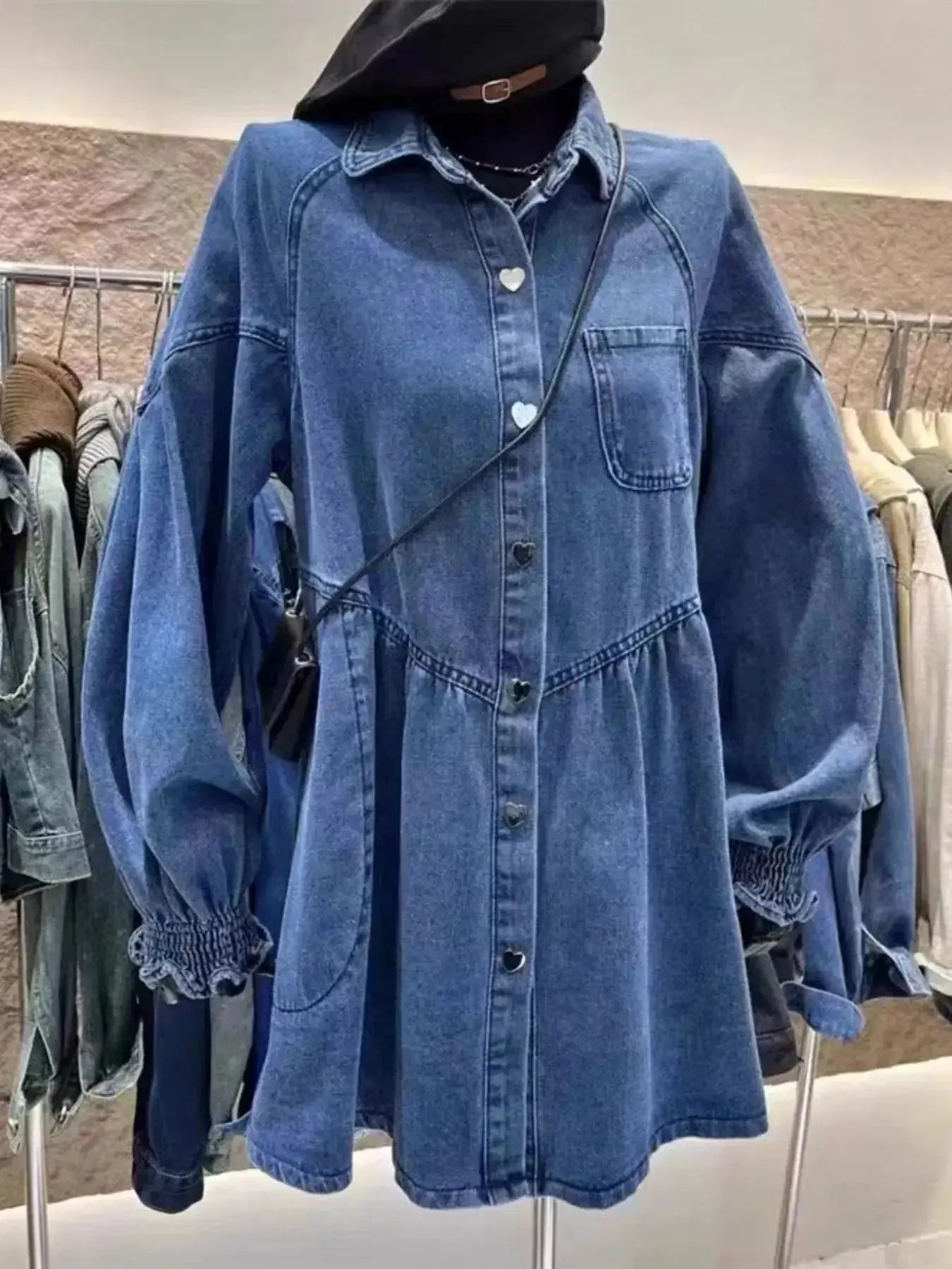 Oversized long sleeve denim dress with button-up front, styled in a casual fit, from Trendsi's Plush Fashion Hub collection.