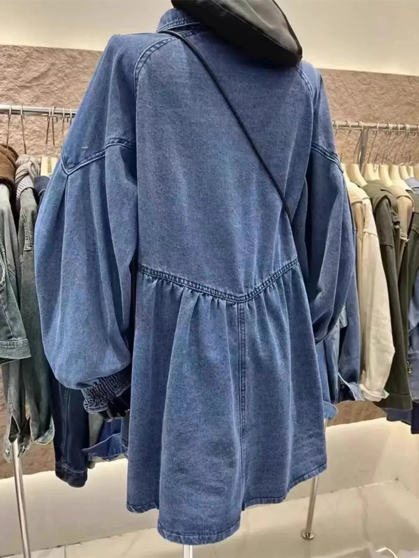 Oversized long sleeve button-up denim dress by Trendsi featuring a relaxed fit, classic collar, and front button closure.