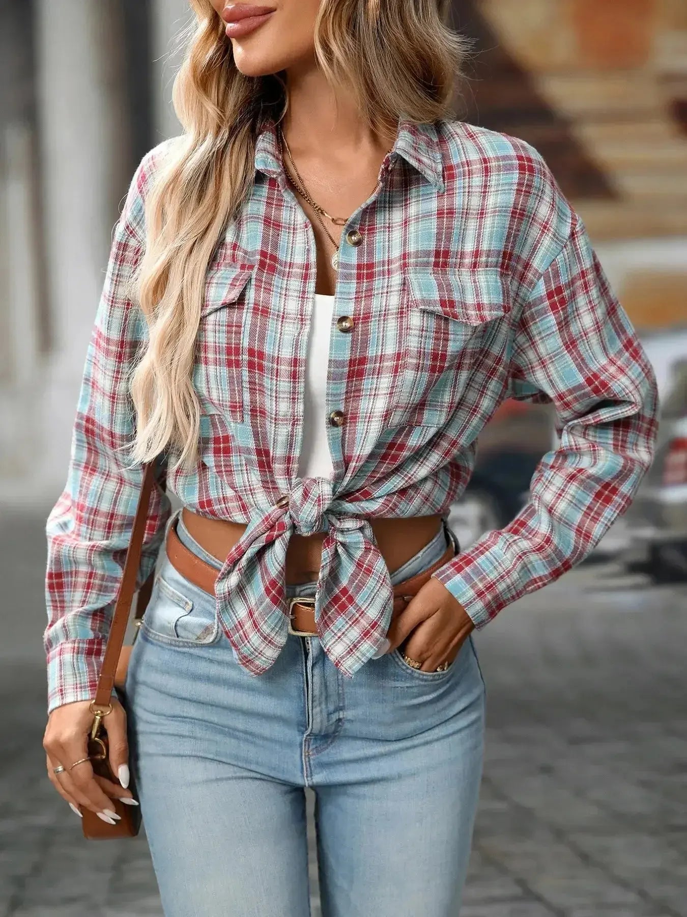 Oversized plaid button-down shirt for women by Plush Fashion Hub, soft casual flannel top with a relaxed fit and classic pattern.