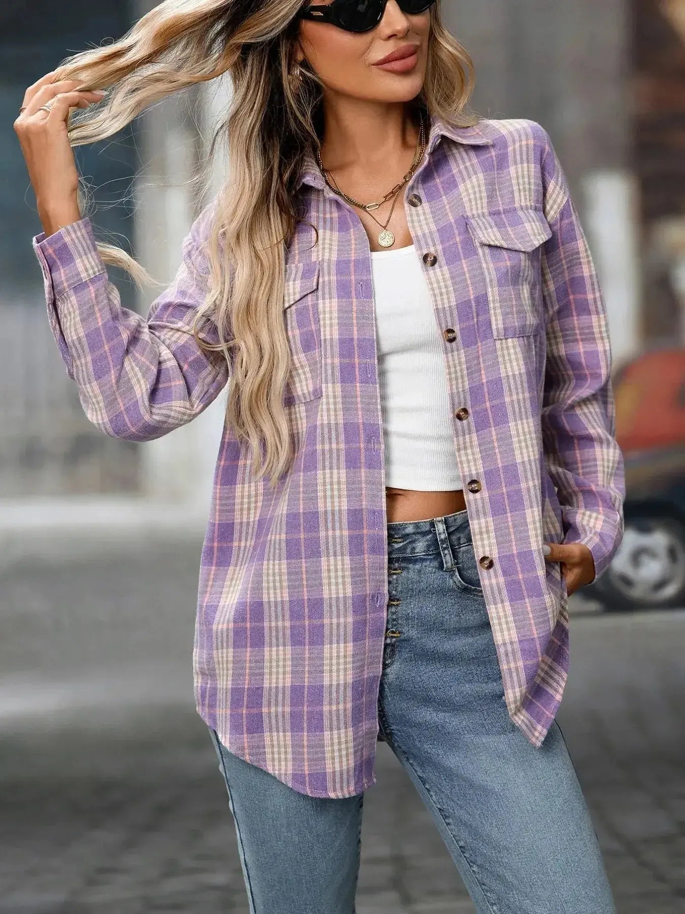 Women's oversized plaid button-down shirt by Plush Fashion Hub, soft casual flannel top with a relaxed fit and classic plaid pattern.