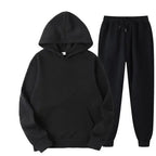 Plush Fashion Hub oversized women's hooded sweatshirt and jogger lounge set made of soft polyester, casual and comfortable fit.
