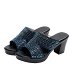 Women rhinestone platform high heels sandals with thick heels and open toes, stylishly designed for fashionable occasions.