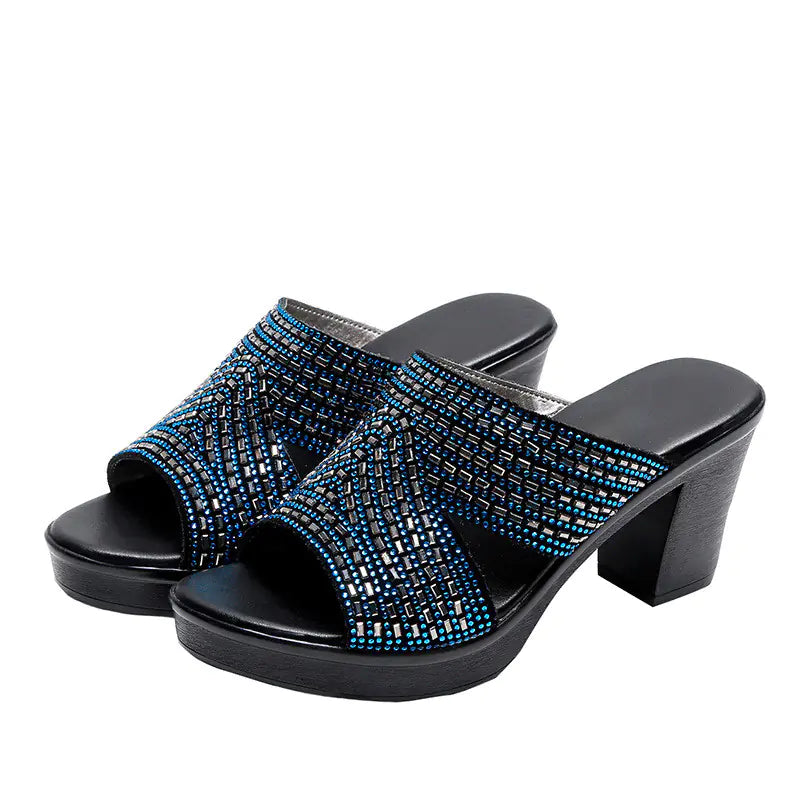 Women rhinestone platform high heels sandals with thick heels and open toes, stylishly designed for fashionable occasions.