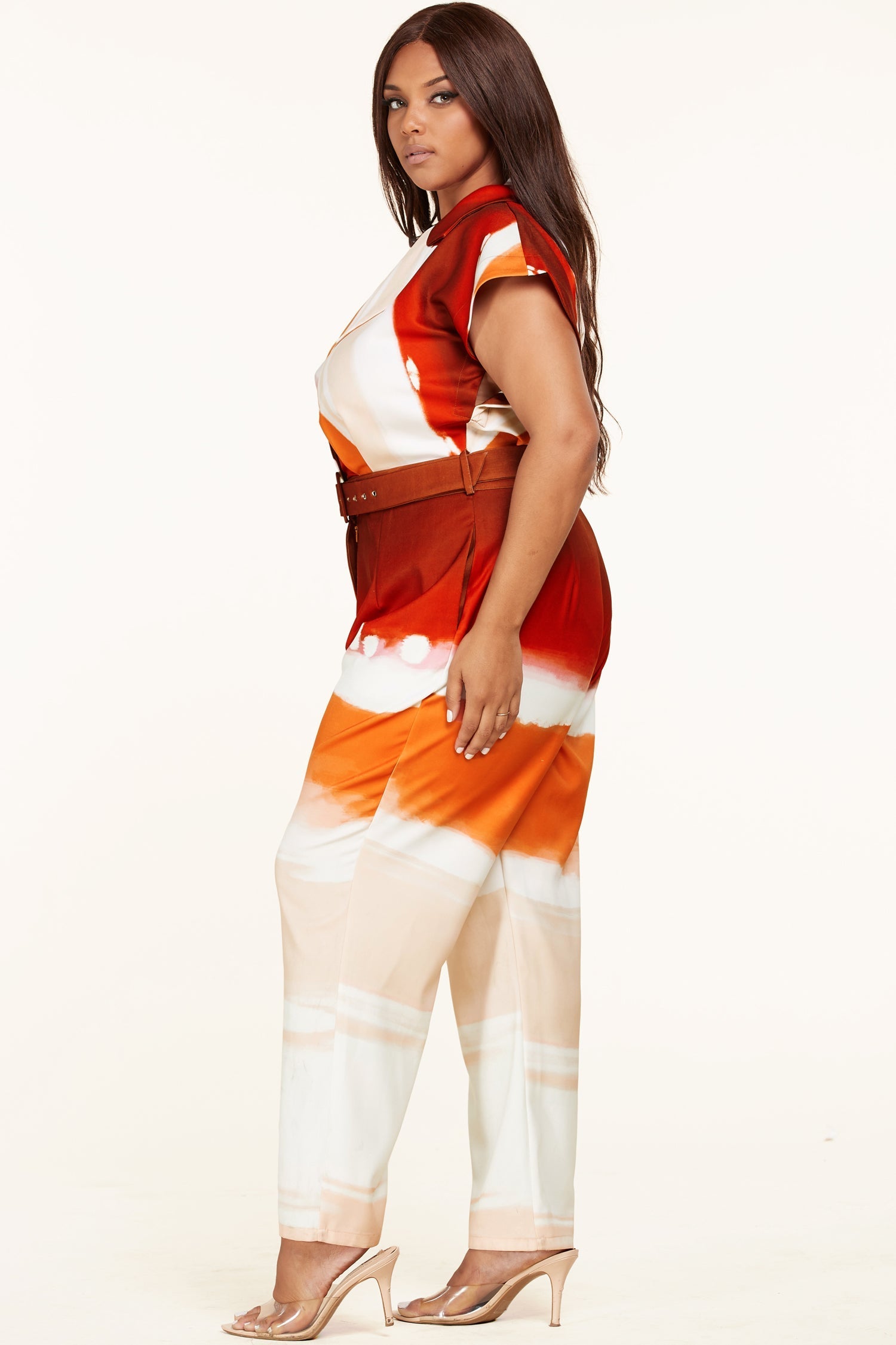 Plus size Sunset Jumpsuit by Fasheabe, vibrant playsuit with a relaxed fit and stylish design, displayed on a hanger.