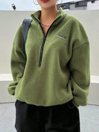 Women's half zip fleece sweatshirt with patch detail and drop shoulder design by Plush Fashion Hub, showcasing cozy fleece fabric.