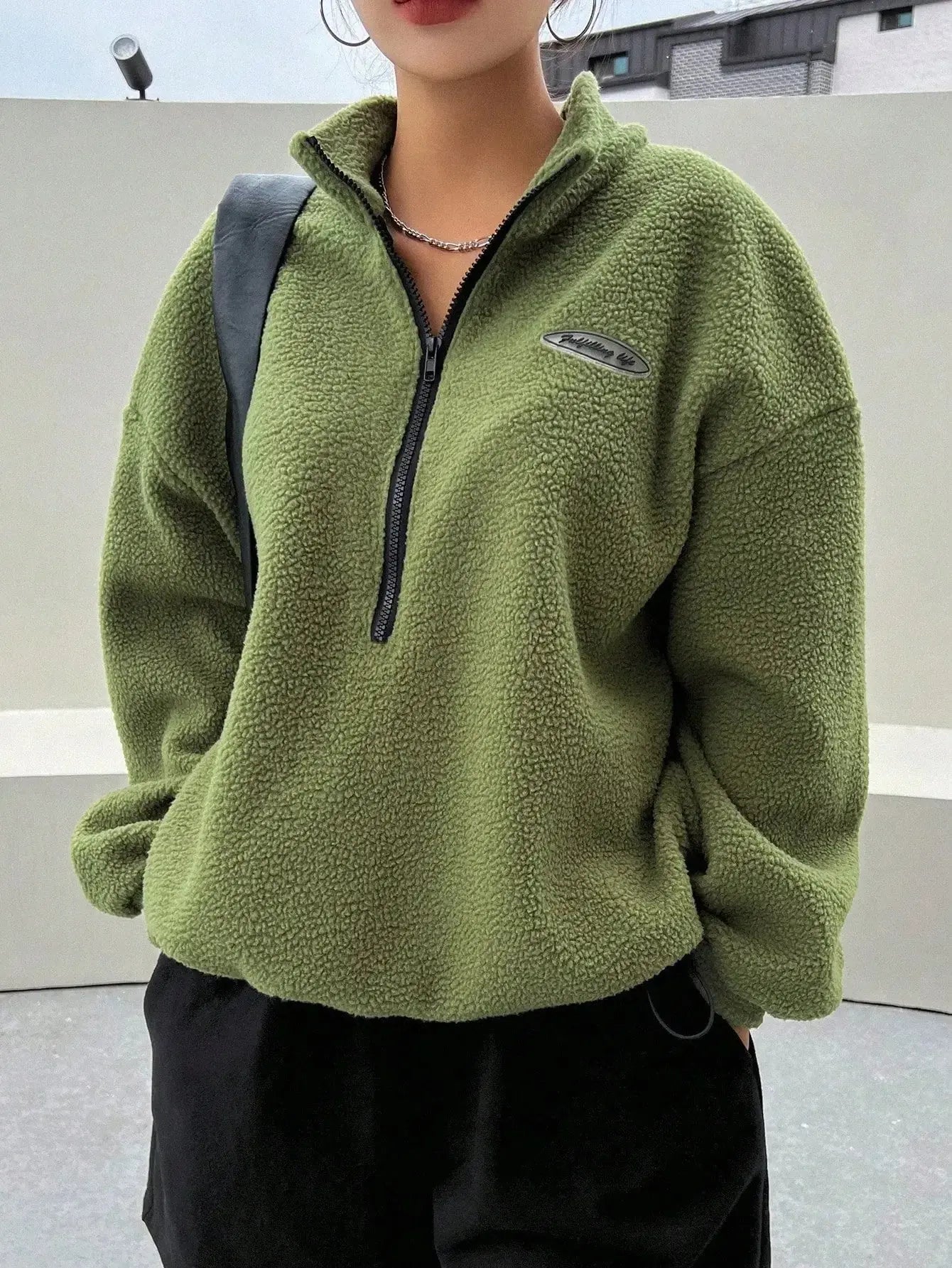 Women's half zip fleece sweatshirt with patch detail and drop shoulder design by Plush Fashion Hub, showcasing cozy fleece fabric.