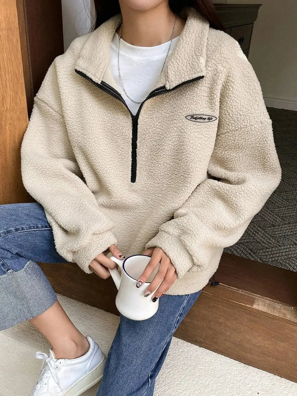 Women's half zip fleece sweatshirt with patch detail and drop shoulder design by Plush Fashion Hub.
